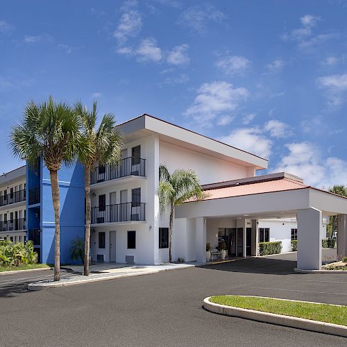 This image shows a three-story hotel building with 